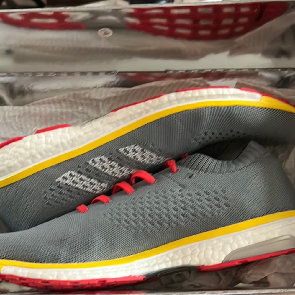 Gray Running Shoes with Yellow and Red Accents